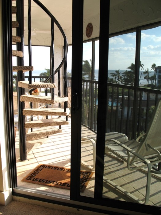 Circular stairs lead to your private rooftop deck