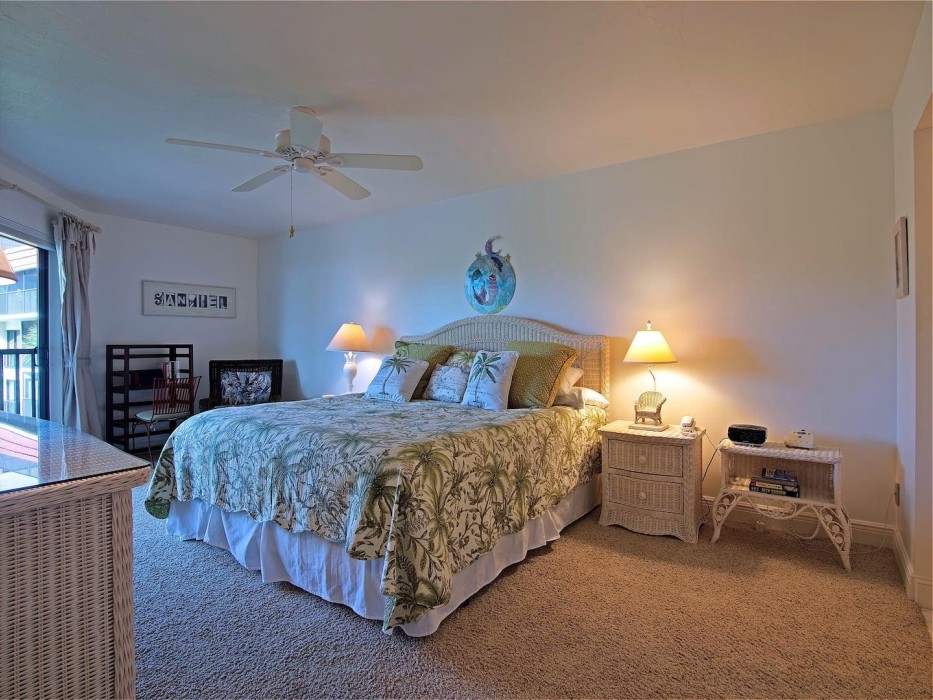 Spacious master bedroom with direct balcony access