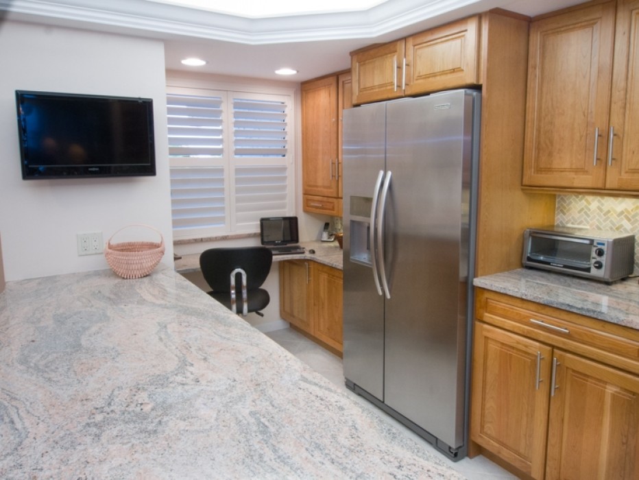 TV and computer area in Updated Kitchen, with stainless steel appliances.