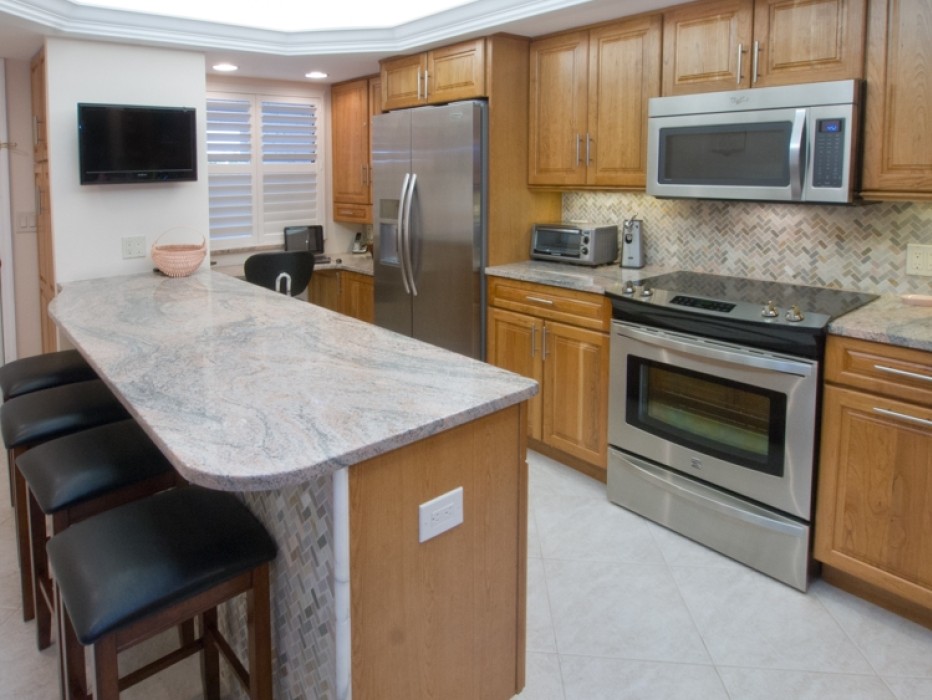 Updated Kitchen with under-cabinet lighting, and Peninsula Island with seating.