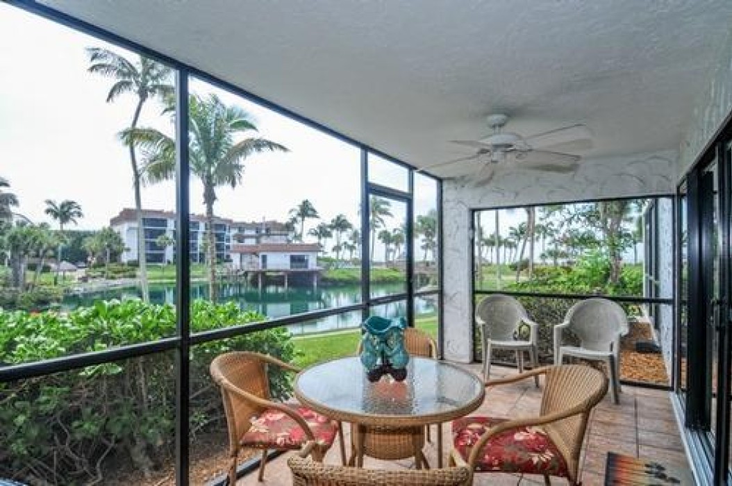 Ground floor screened lanai, equipped with beach chairs, beach wagon, umbrella and table and chairs