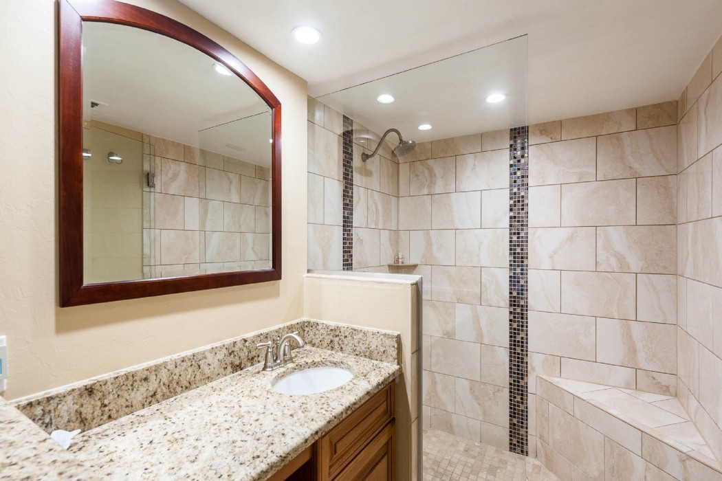 The master bath has a convenient vanity sink/makeup seating area and huge walk-in shower!