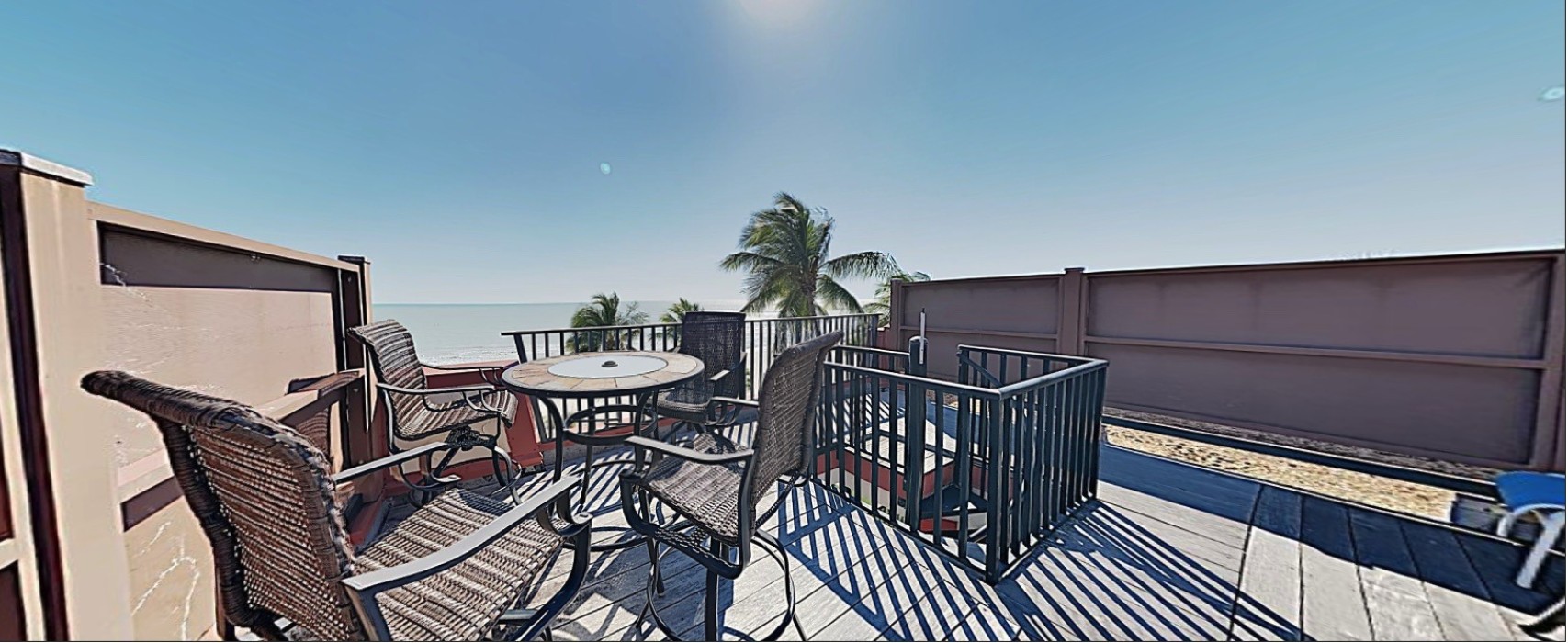 E45: View of the Private Sundeck. 4 Sun loungers and a Bar Table with 4 Chairs