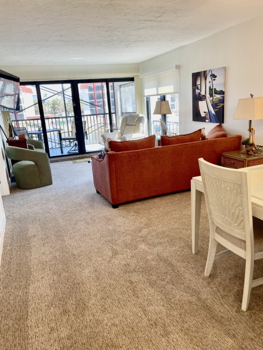 Living room/Dining room with 55” TV and gulf/lagoon views