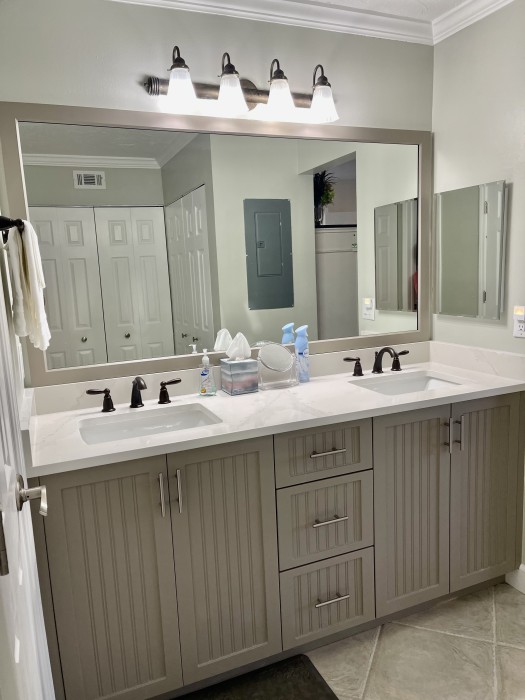 Master bath with two sinks and a walk-in shower.