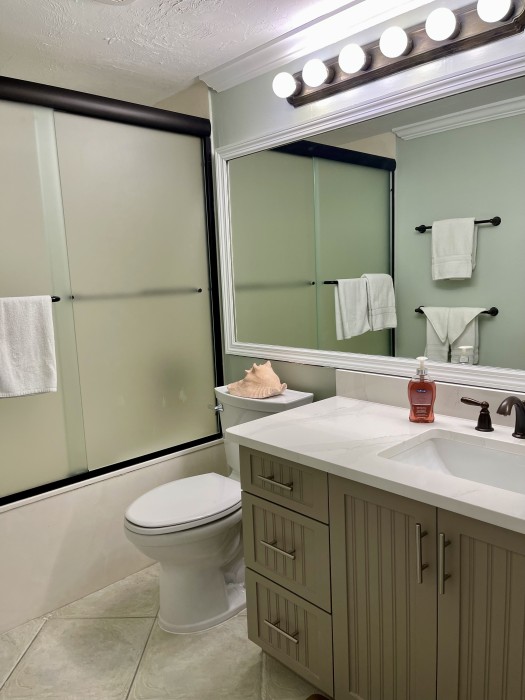 Guest bath connecting to guest bedroom, it has an oversized tub/shower