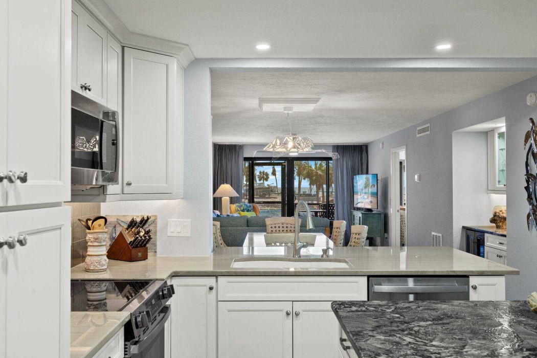 Kitchen - looking through to the Lanai and the Lagoon and Gulf beyond.