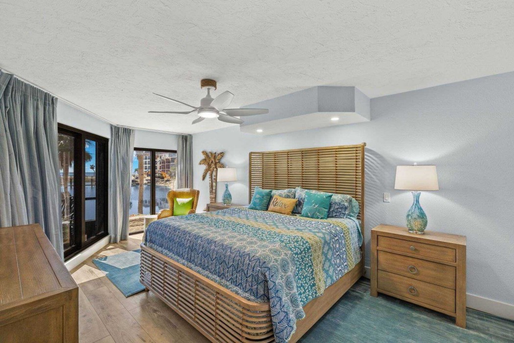 Master Bedroom with a king-size bed and seating area.