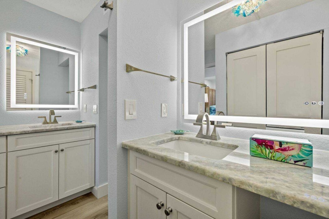 Master Bath with two vanities, a closet and step in shower.