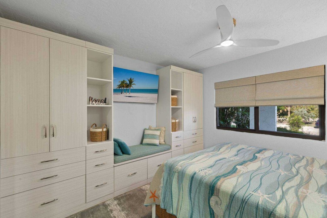 Guest Bedroom 1 with lots of drawer and closet storage.