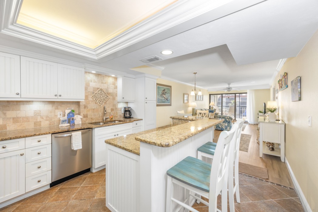 Large, well equipped, renovated kitchen, white custom cabinets & granite countertops