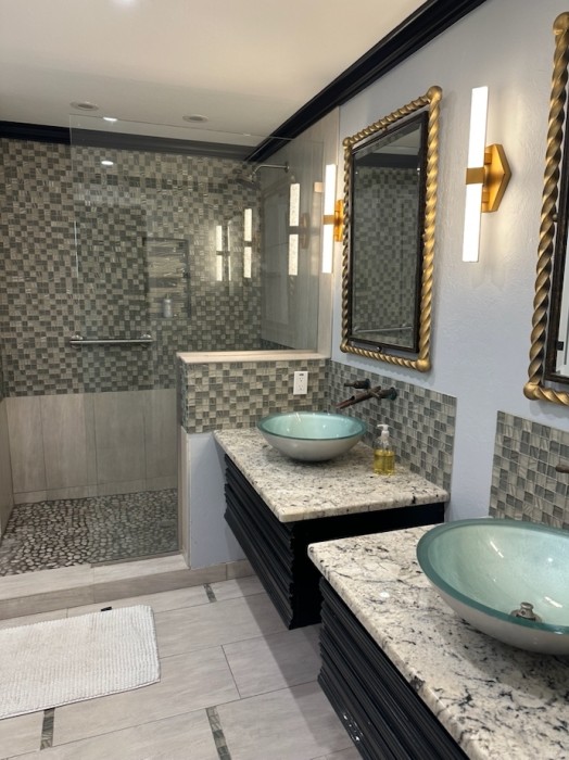 Renovated baths include state of the art shower with rain head and hand held fixtures