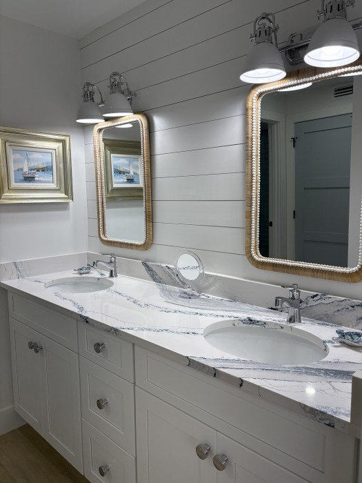 Primary en suite bathroom with double sinks.