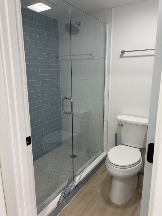 Primary bathroom - Walk in custom tiled shower.