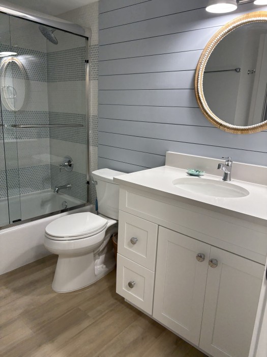 Guest bathroom with combination tub/shower.
