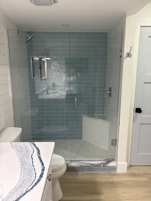 Primary bathroom - Walk in custom tiled shower.