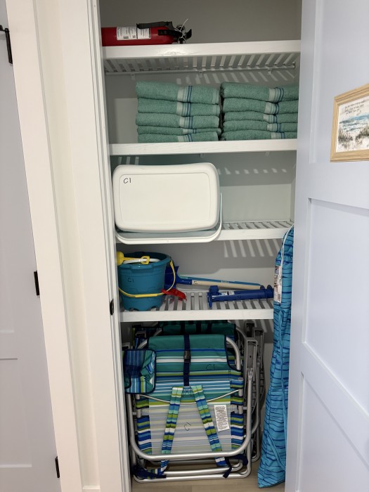 Beach towels, beach chairs, umbrella, cooler and beach toys for fun in the sun!