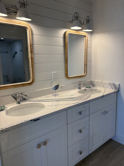 Primary en suite bathroom with double sinks.