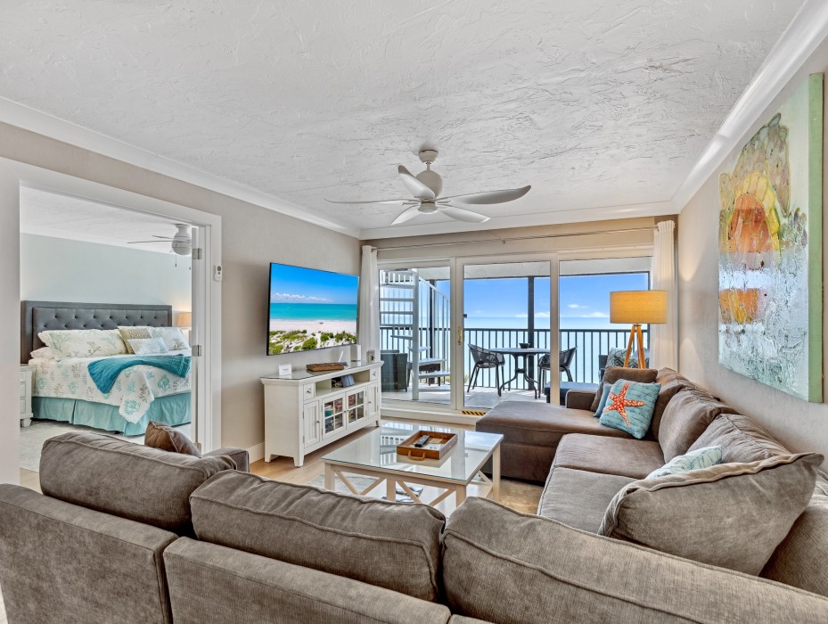 Living room with sliders to lanai/rooftop access