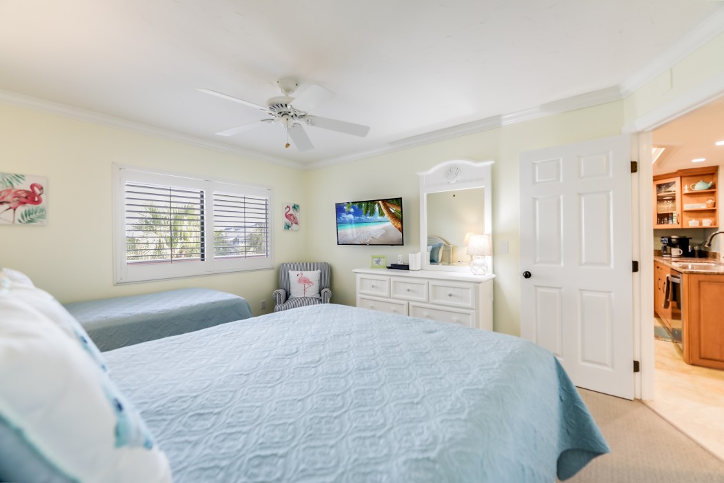 Guest Bedroom with a 55 inch flat screen television.
