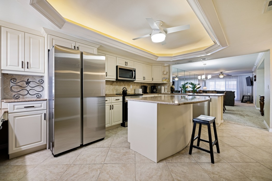 Modern kitchen with spacious granite counters and stainless steel appliances