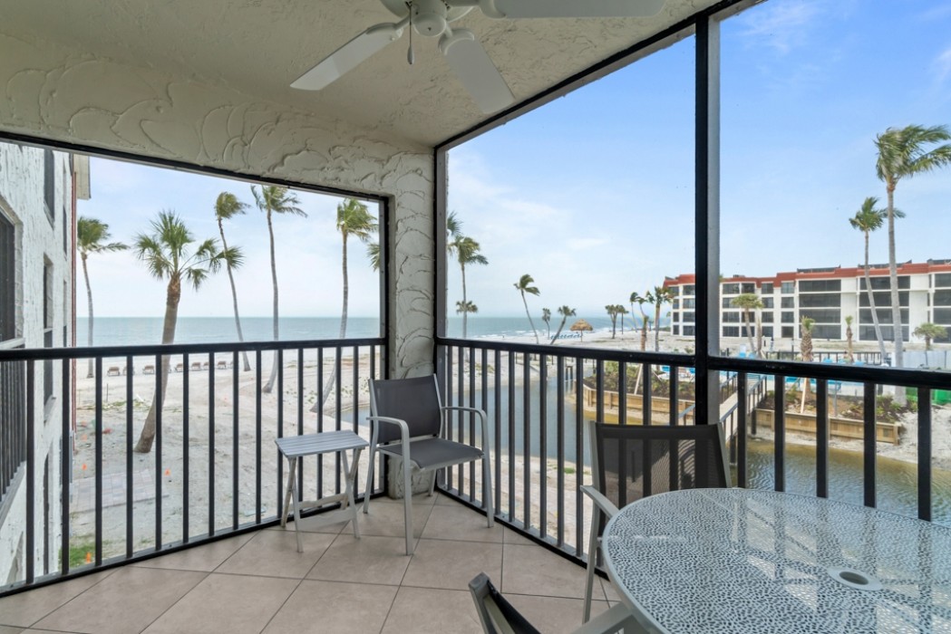 Patio view of the gulf, pool and courtyard