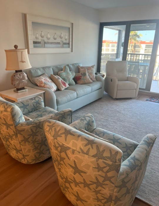 Lots of room to relax in the living room with smart tv and views of the Gulf.