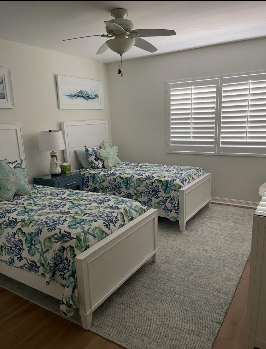 Two twin beds (which can be converted to a king) are comfy spots to rest or watch smart tv after a fun day on the island.