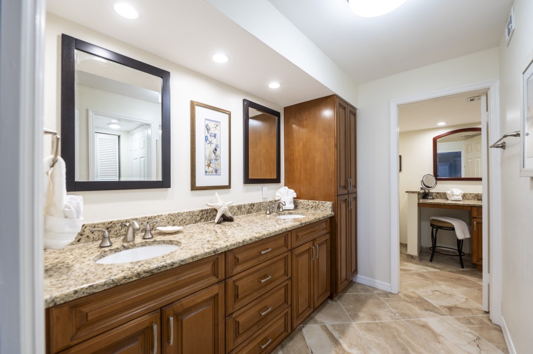 The master bath has a large double vanity and plenty of storage space.