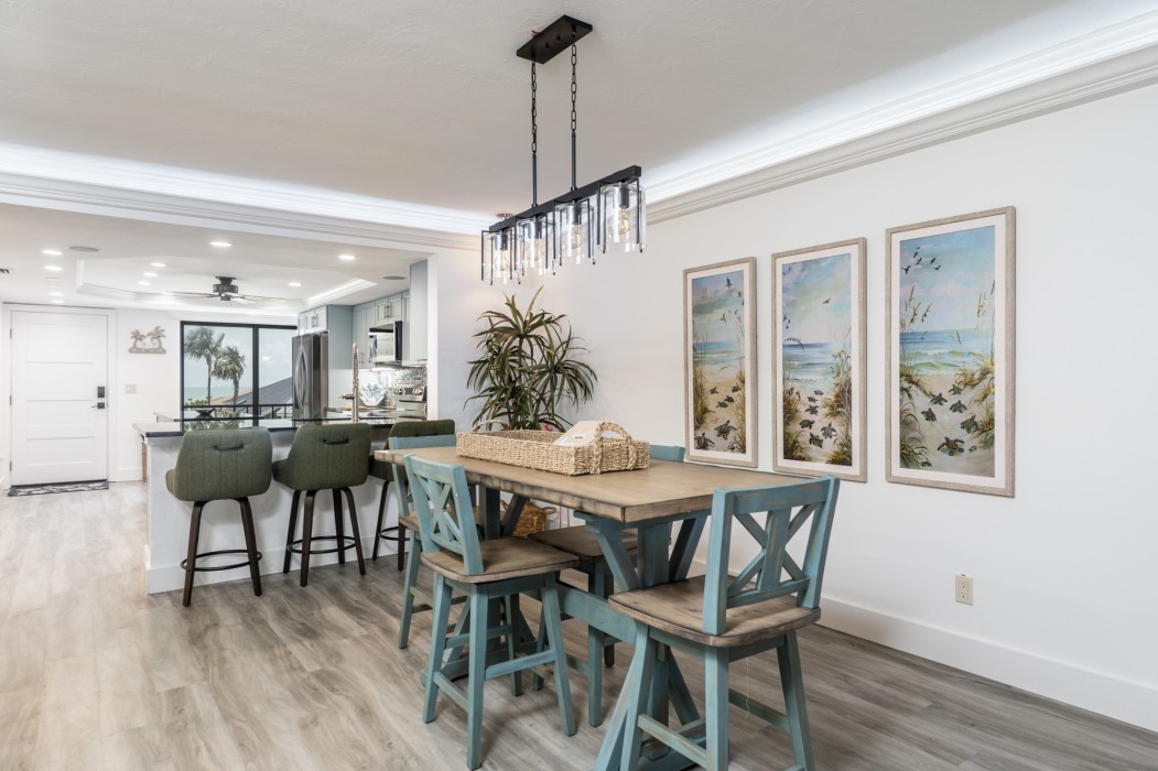 Living room and dining room are professionally decorated with tropical furniture