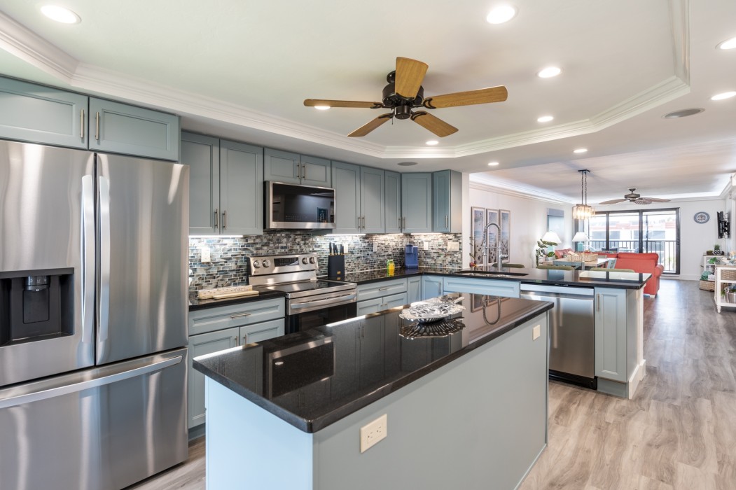 The kitchen has Silestone countertops and a tiled stone/glass backsplash