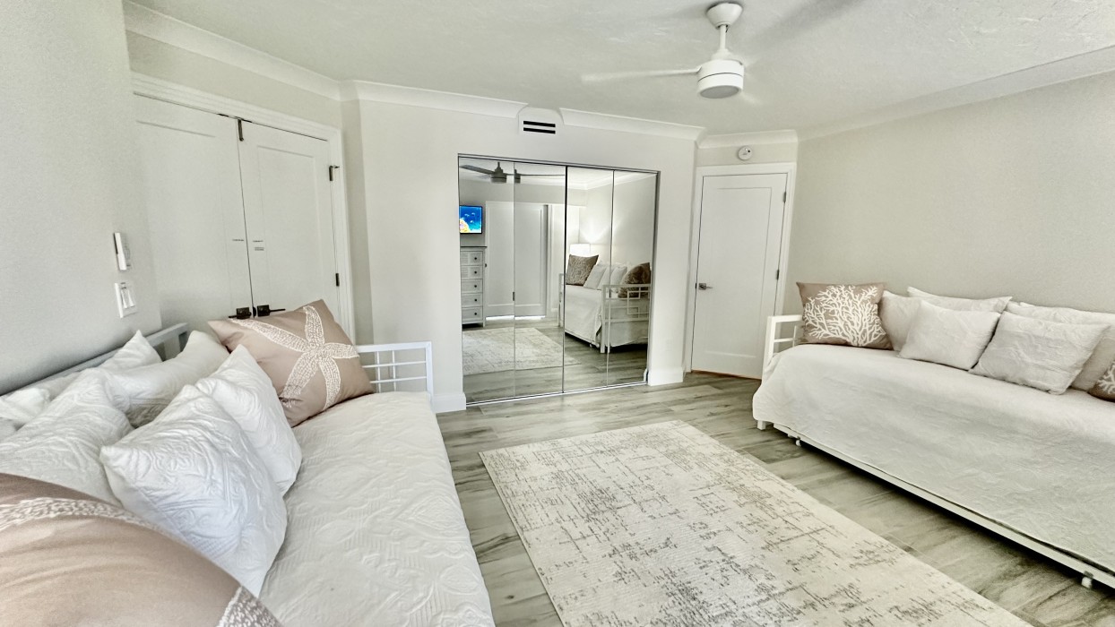 Privacy doors lead to the guest bath and living area.