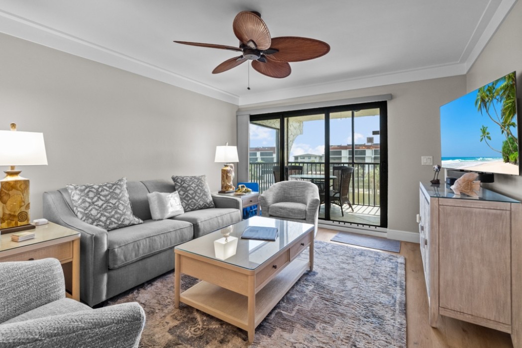 Living room with tv and view to the patio